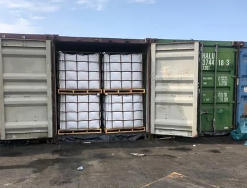 An open container stowed with jumbo bags.